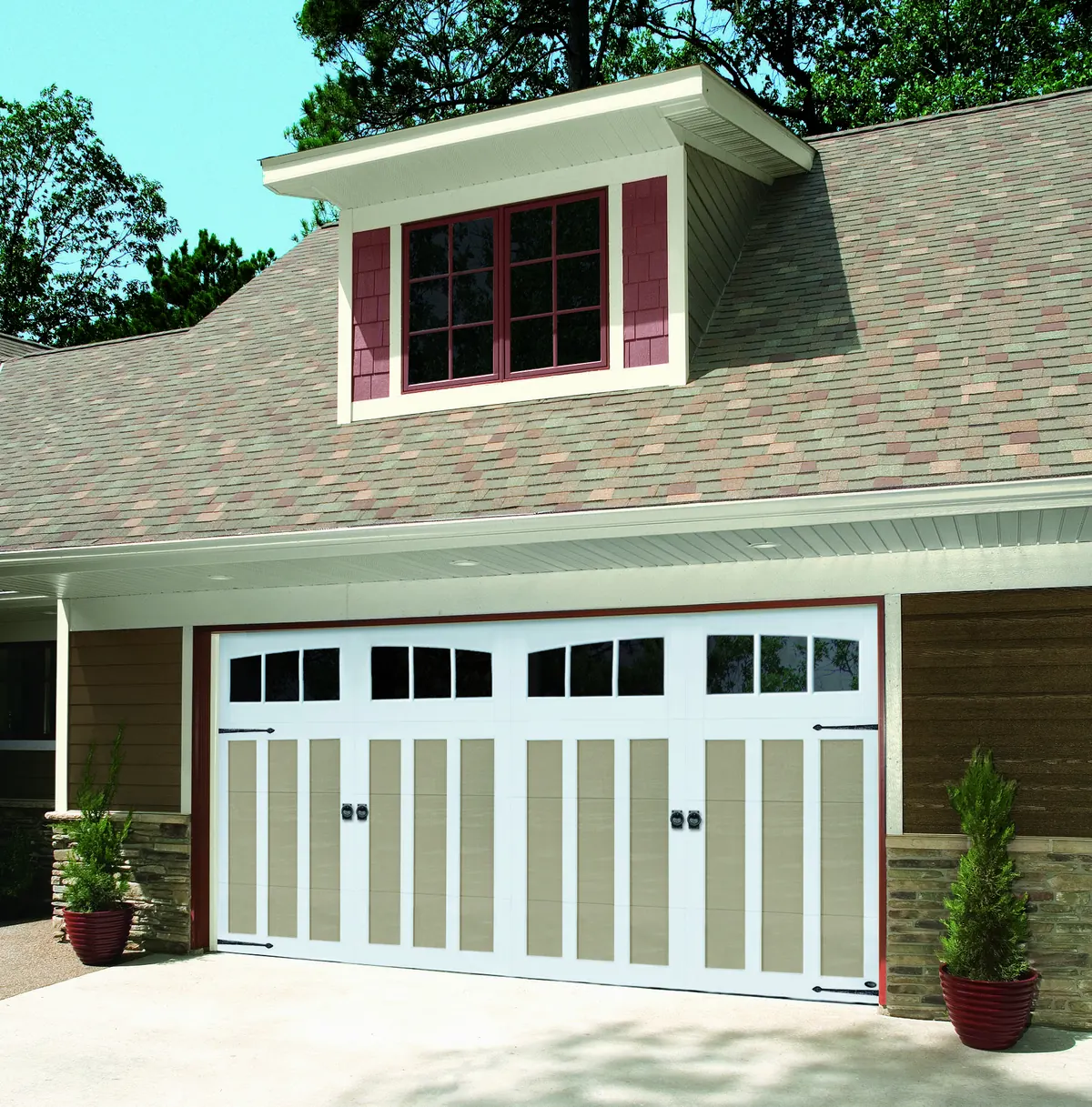 Tan Amarr Carriage Court door with cross buck overlays and windows