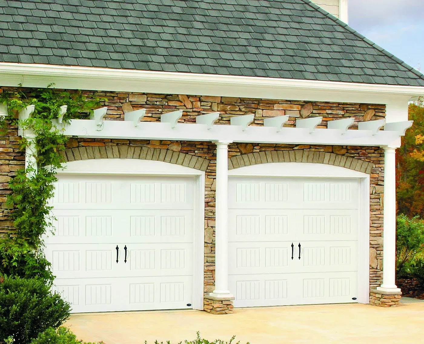 Amarr Designer's Choice insulated doors in white beneath a pergola