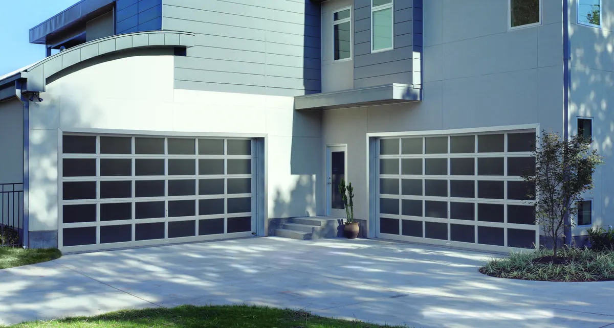 Two grey Amarr Vista full view doors with obscure glass on a modern home