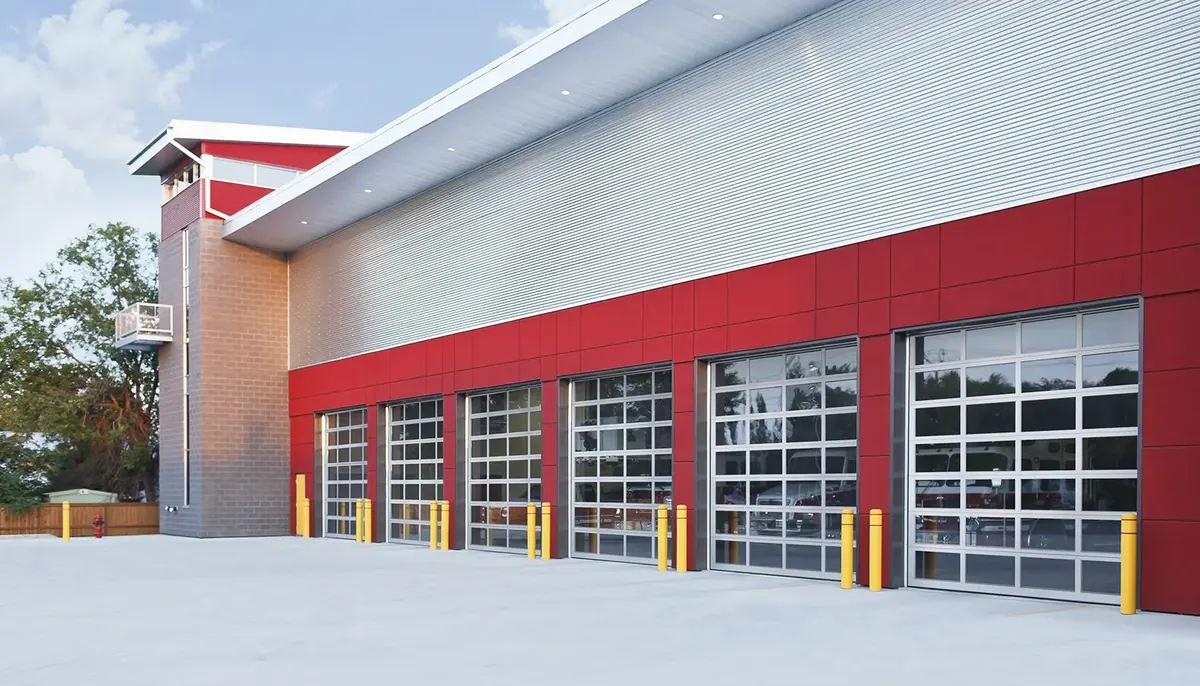 Clopay Model 904 architectural aluminum full view doors on a red commercial building