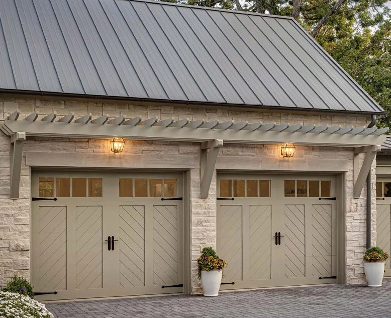Clopay Canyon Ridge Chevron doors with mahogany cladding and overlays