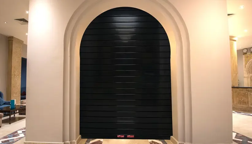 A Clopay EntryDefender rolling security door in an arched opening