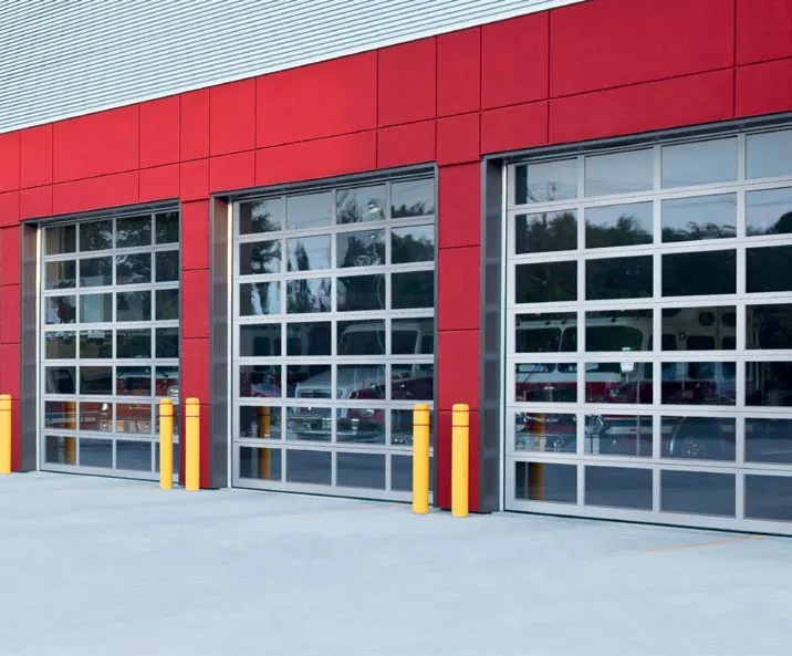 Clopay Architectural aluminum 904 door, closer view of three full view aluminum doors on a red fire station. From the Model 904/904U data sheet