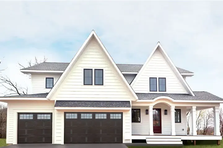 Raynor Country Manor garage door, two dark doors with window rows on a white farmhouse