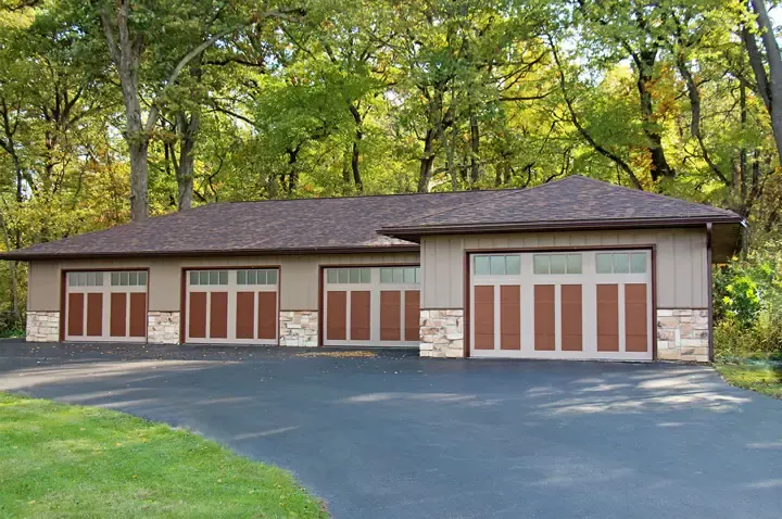 Raynor RockCreeke garage door, four two tone carriage style doors on a long garage