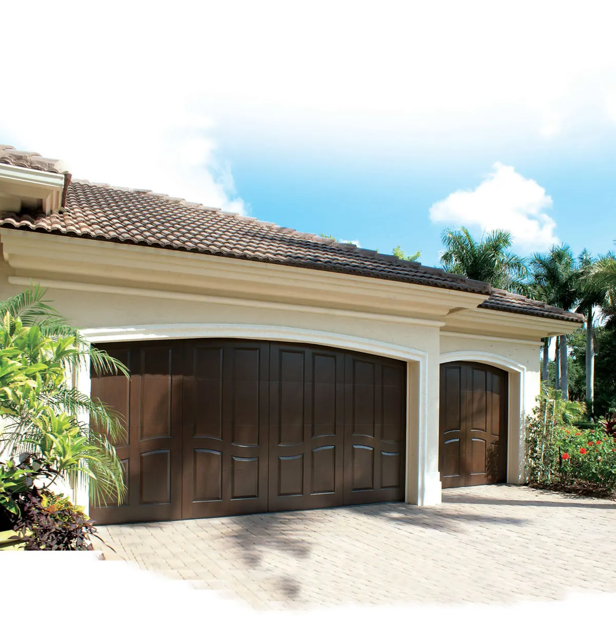 Eden Coast composite wood look door on a Florida stucco home with a tile roof and palms