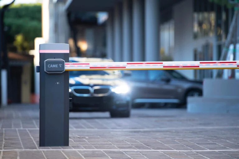 An automatic barrier arm lifting for a car at night