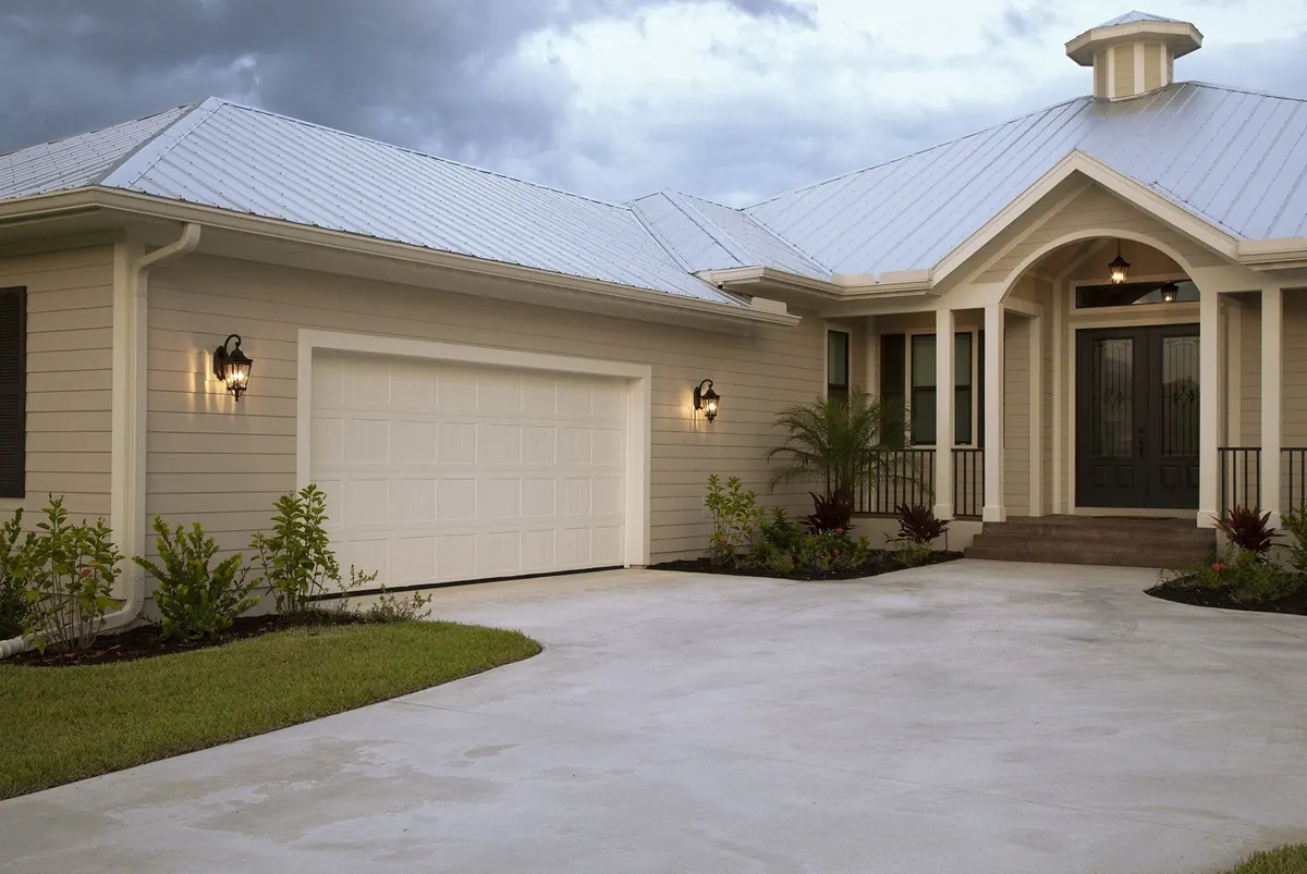 White Haas 2400 series door on a coastal Florida home with a metal roof