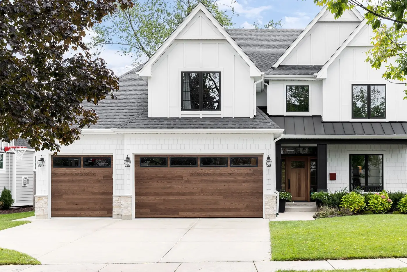 Haas Door 600 series polyurethane-insulated garage door with woodgrain finish