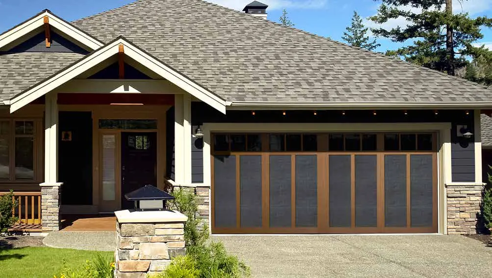 Haas American Tradition wood look carriage doors on a craftsman home