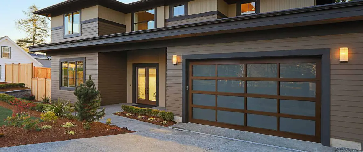 Haas 360 series aluminum and glass door on a modern dark home