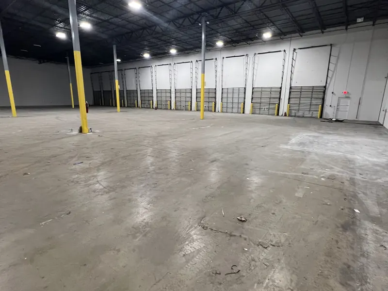 Row of dock doors along an empty warehouse
