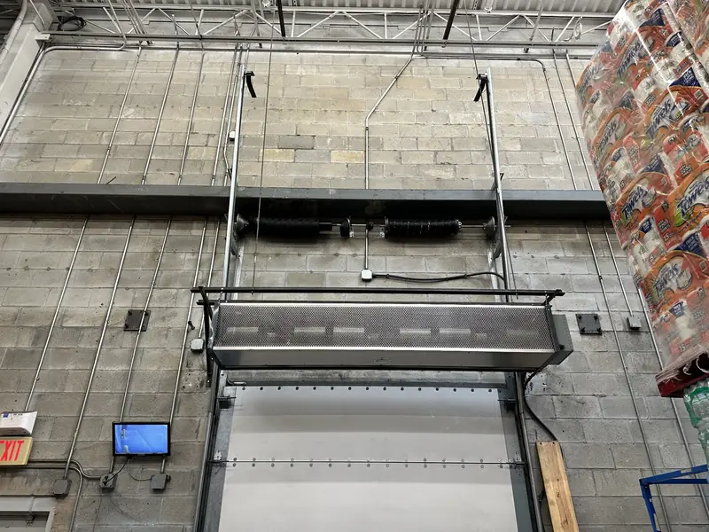 High lift track commercial door at a warehouse dock
