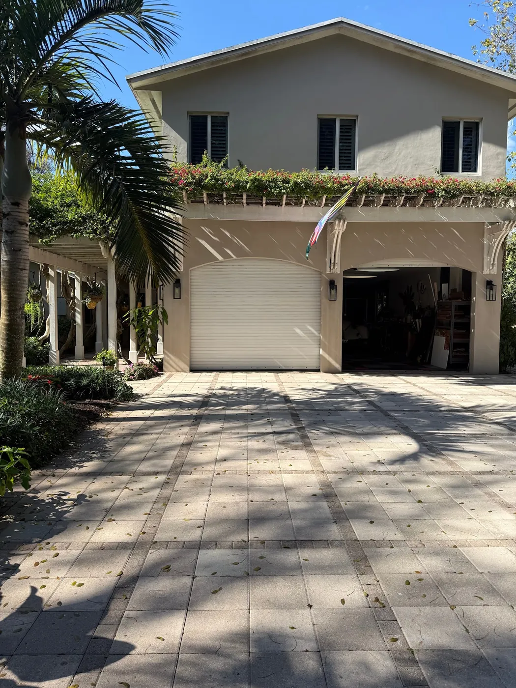 Completed white garage door installation on a Miami property