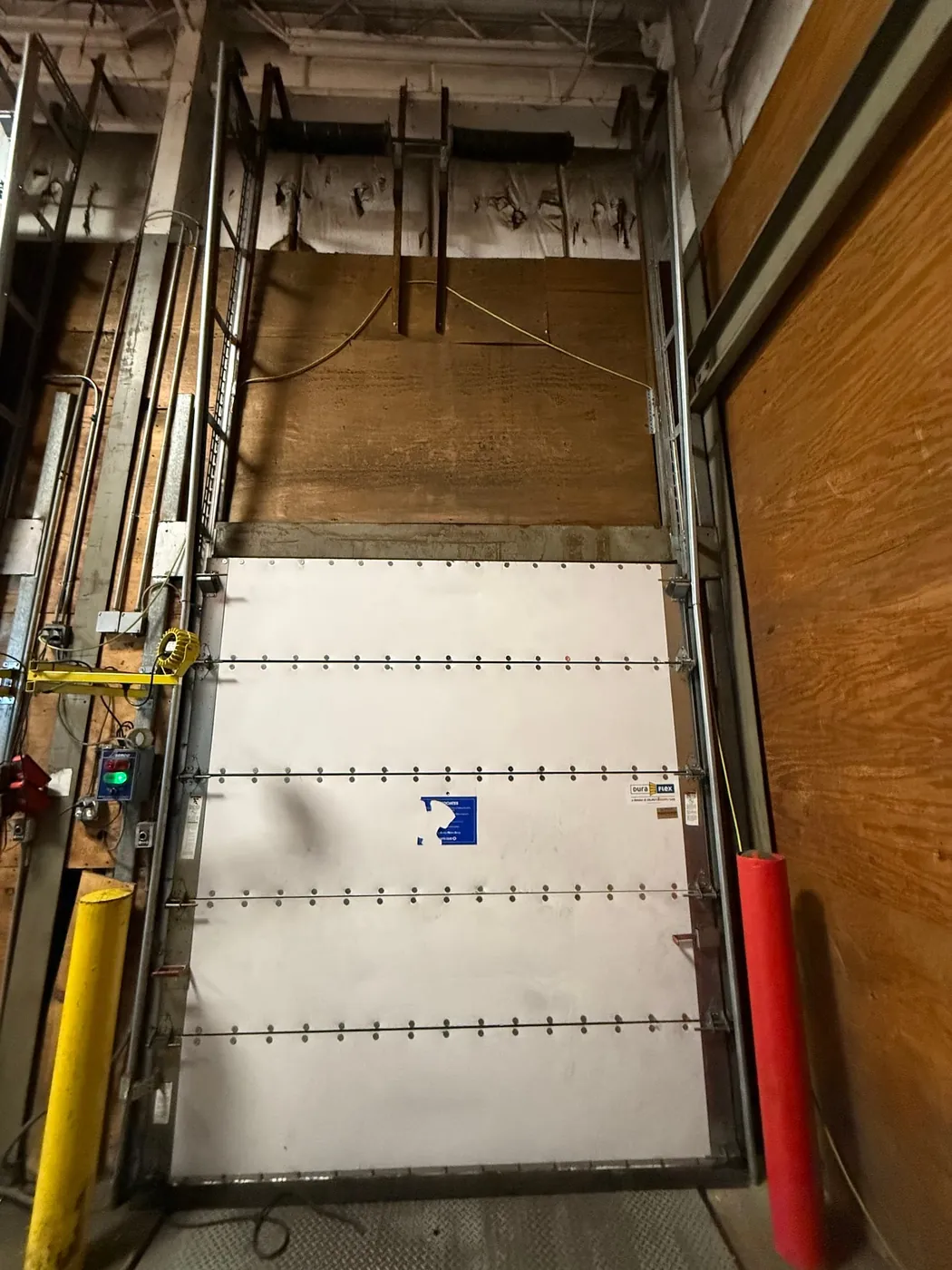 Commercial loading dock door open after servicing