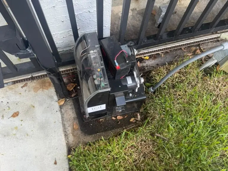 Slide gate operator installed beside a driveway