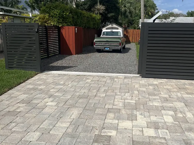 Sliding gate on a paver driveway