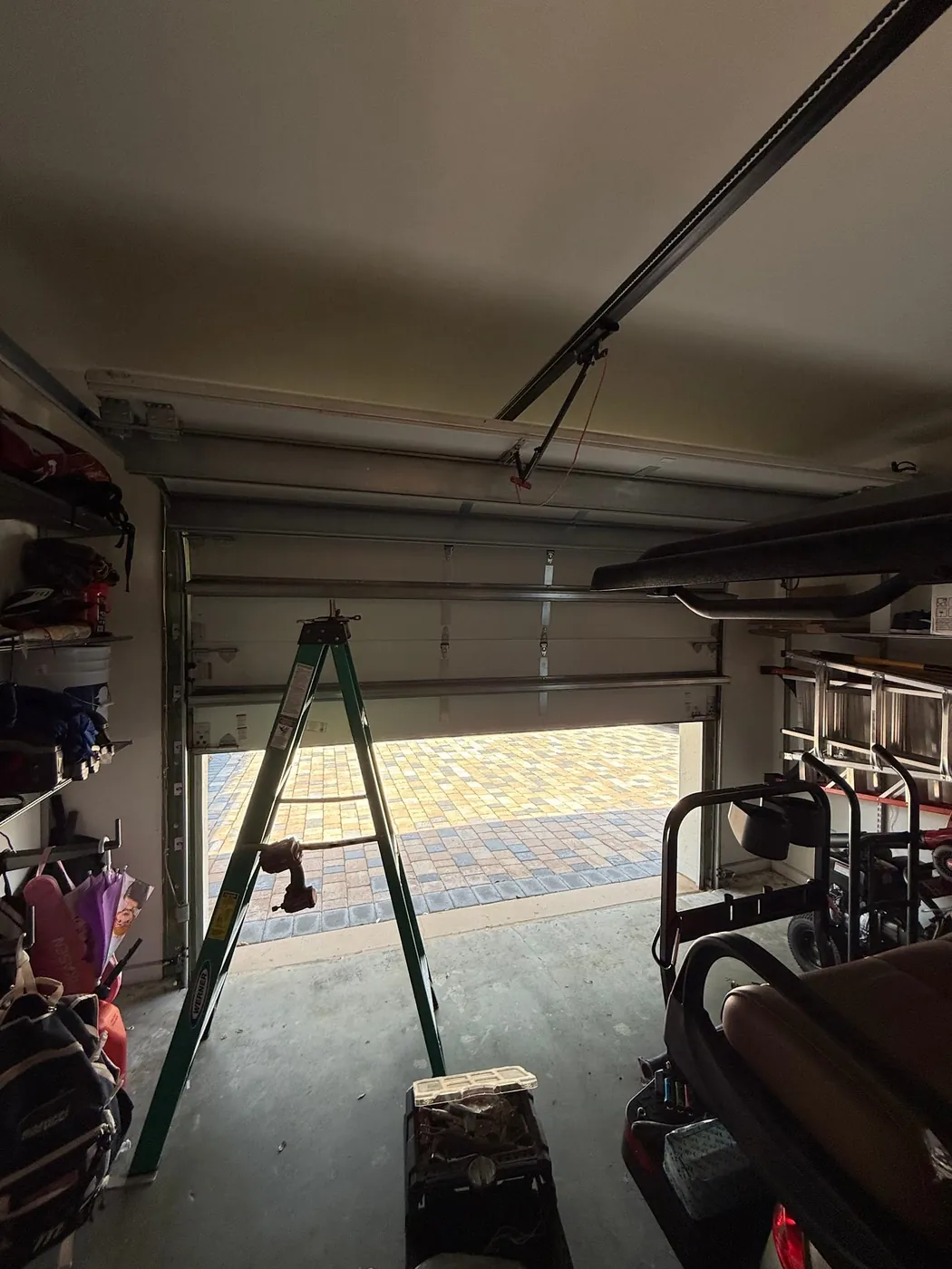 A CMC technician's equipment during a garage door repair