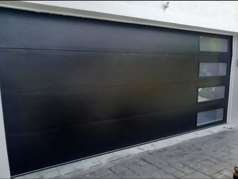 Modern flush black double garage door with vertical windows