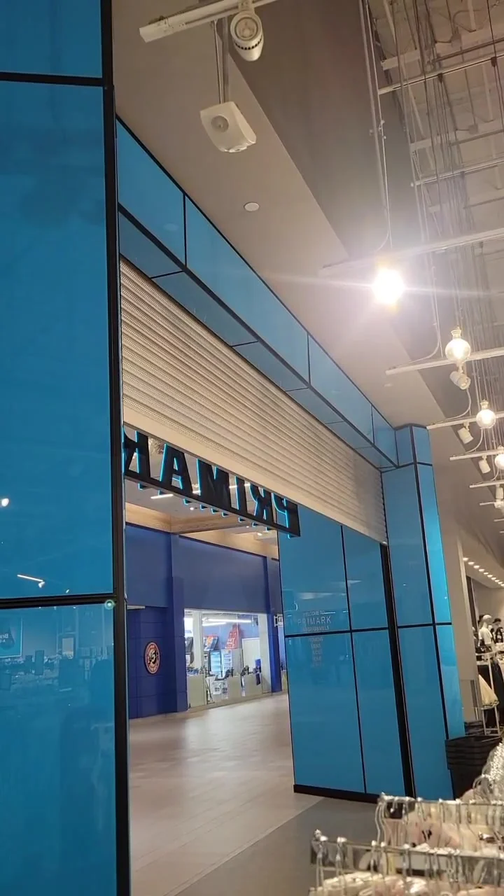 Retail shopfront rolling door raised at a mall unit fitted by CMC Door Service