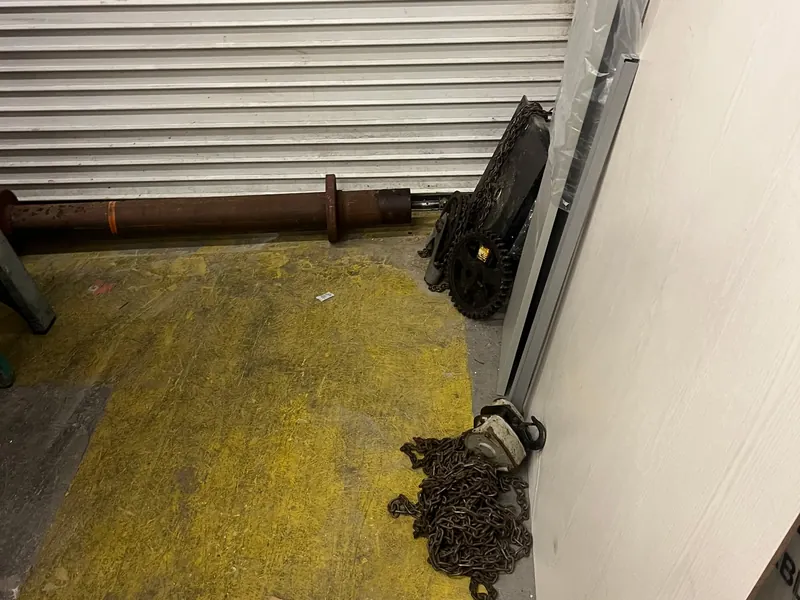 Chain hoist on a rolling steel door