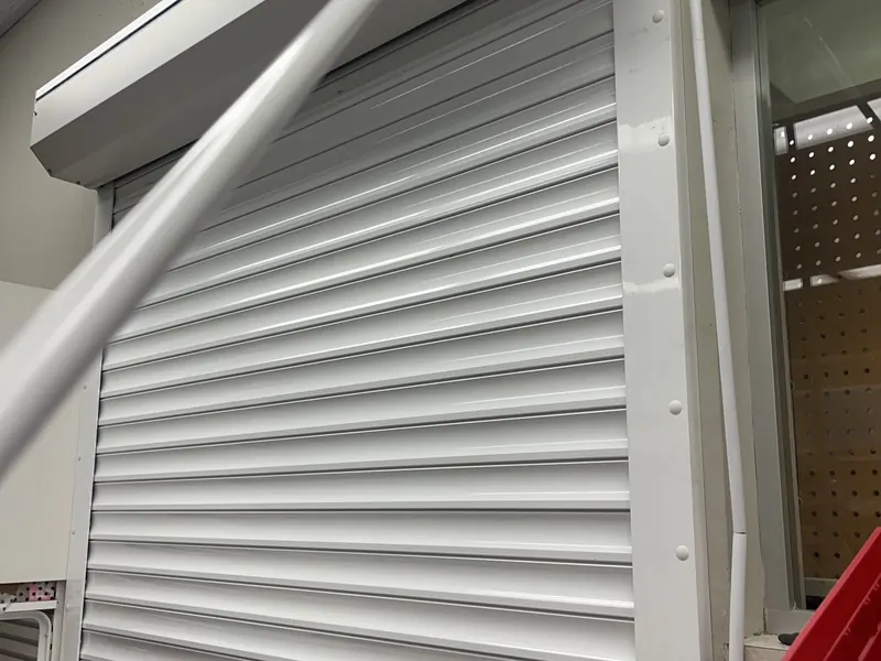 White rolling counter door at a retail counter