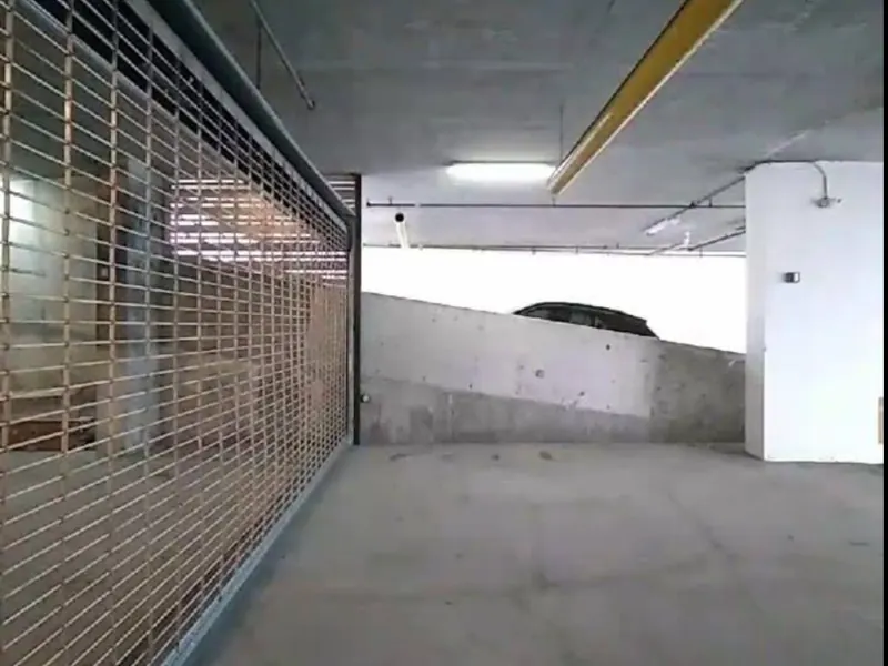 Rolling grille inside a parking garage