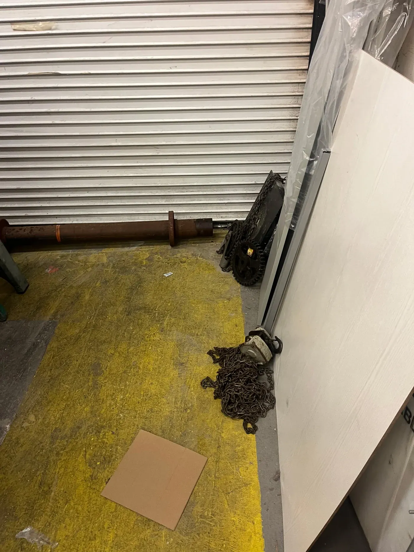Rolling door operator removed to the floor during a motor replacement