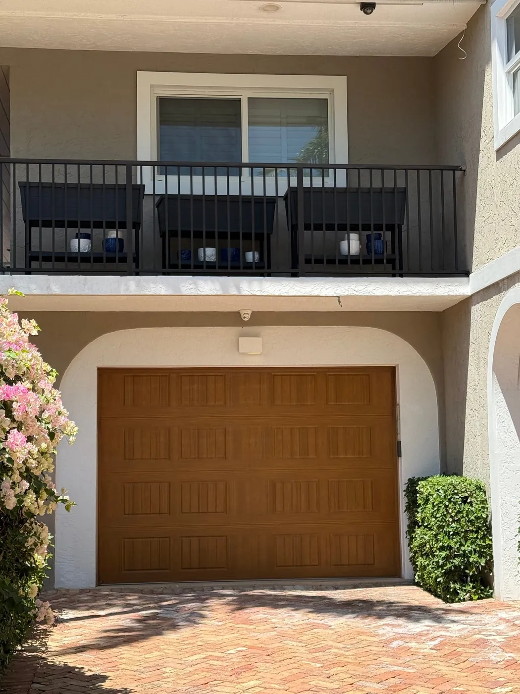 Wood-grain garage door fitted to a South Florida townhouse