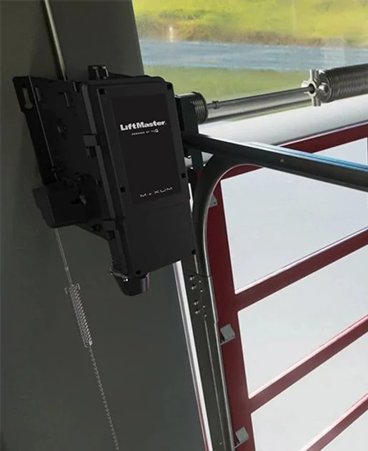 LiftMaster Maxum operator mounted on the jamb of a red rolling steel door