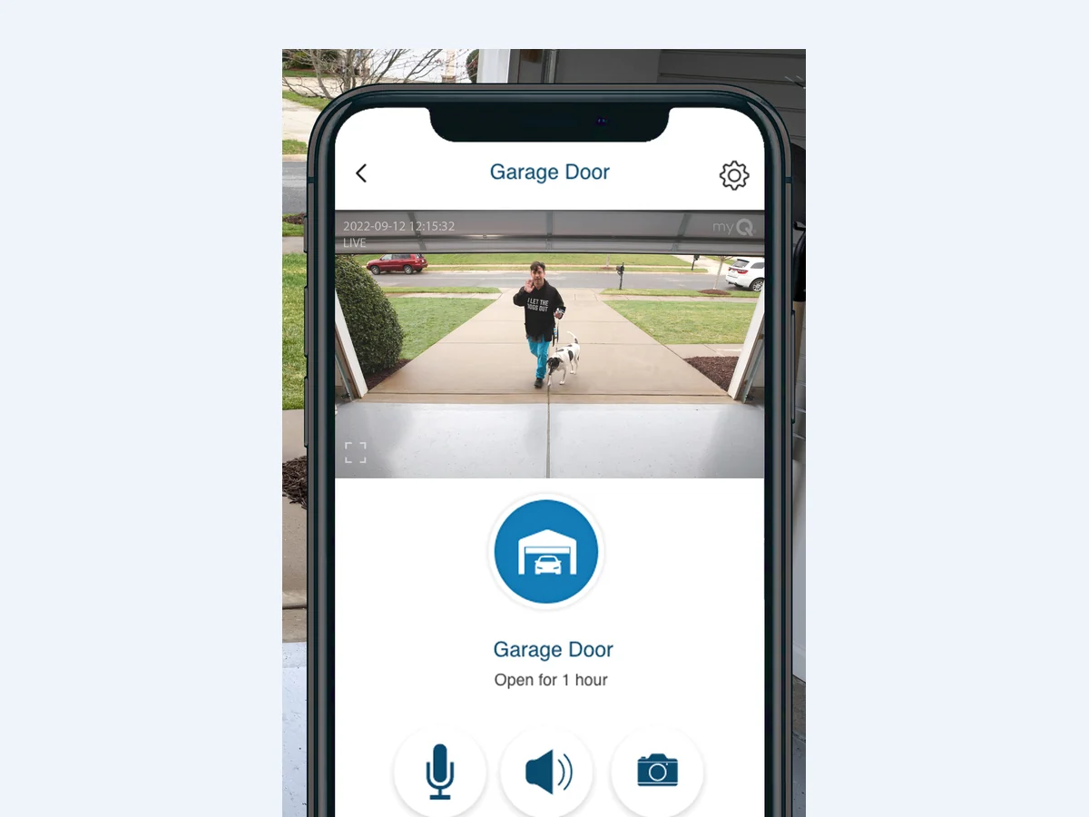 The myQ app on a phone showing a live camera view of the driveway and a control to close the garage door