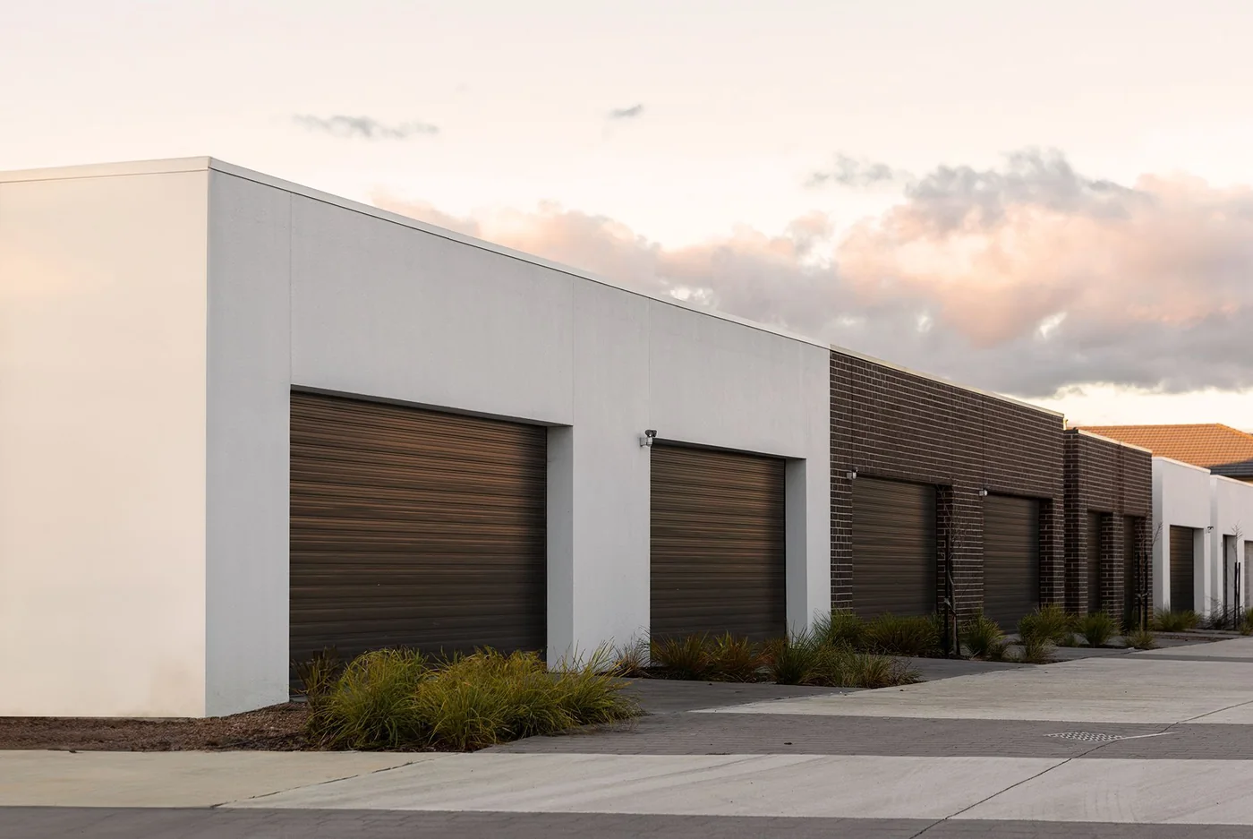 A run of commercial sectional doors on a distribution building