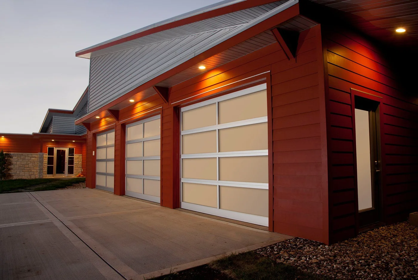 A red clad service building with a full view glass door
