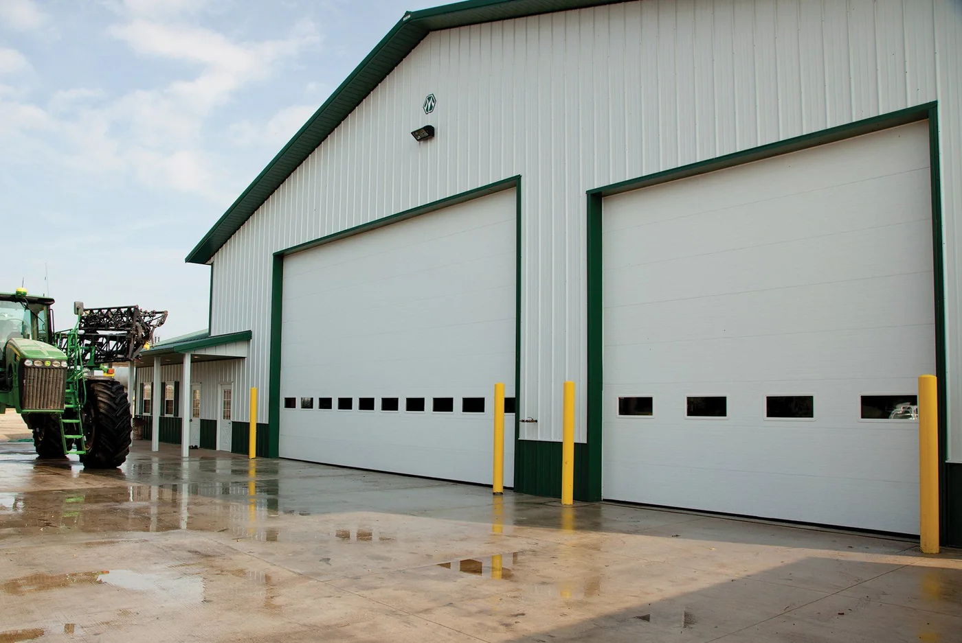 Tall commercial doors on an agricultural equipment building