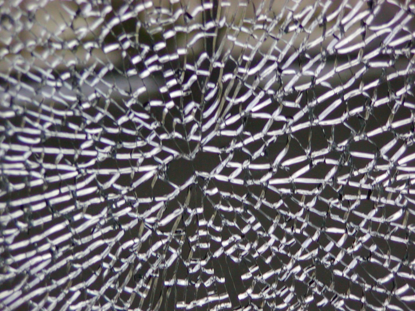 Impact rated glazing after a strike, cracked right through but held in the frame