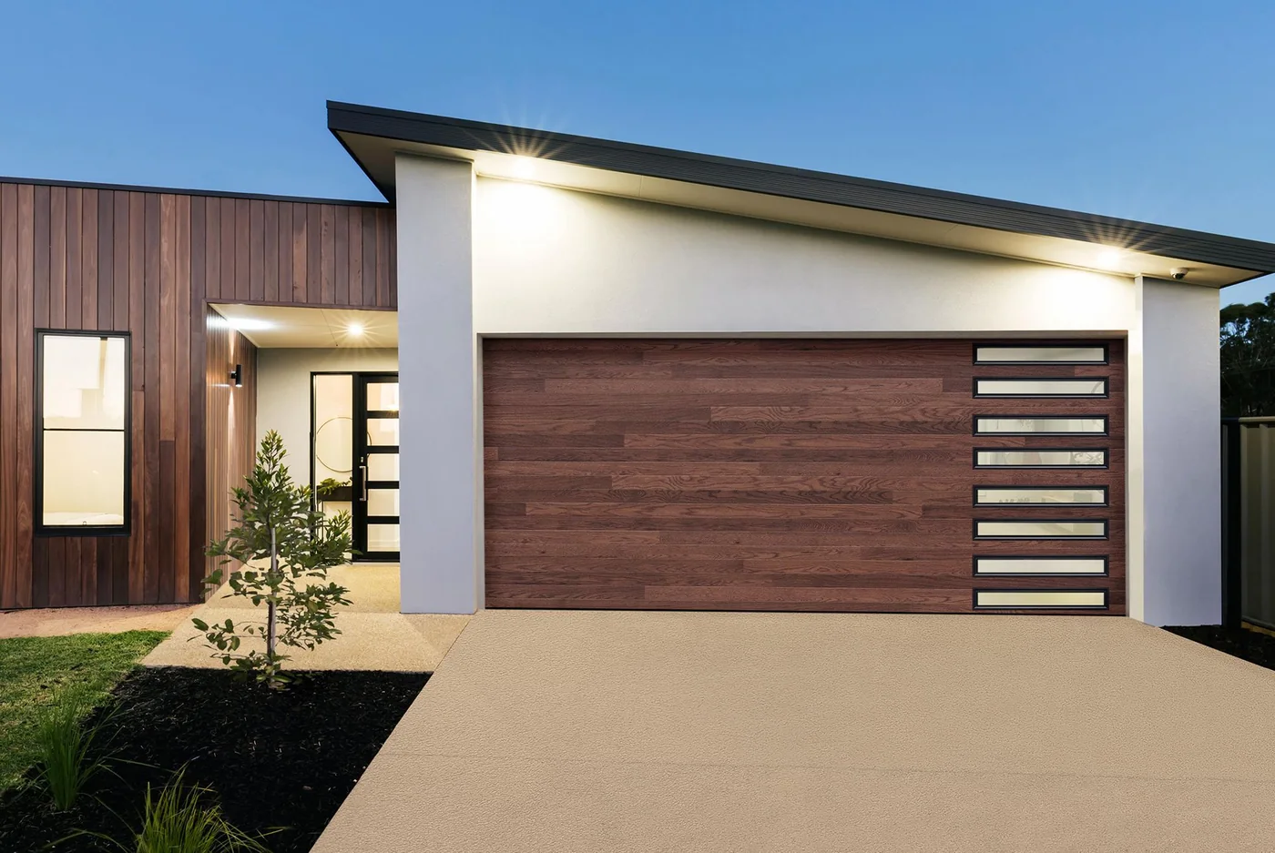 A modern home with a horizontal wood plank garage door