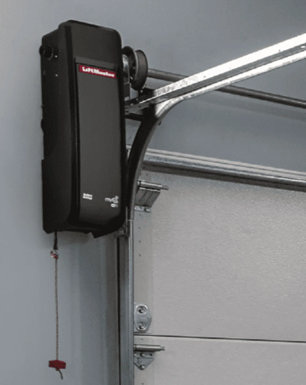 A wall-mount jackshaft operator fitted beside the door, freeing the garage ceiling