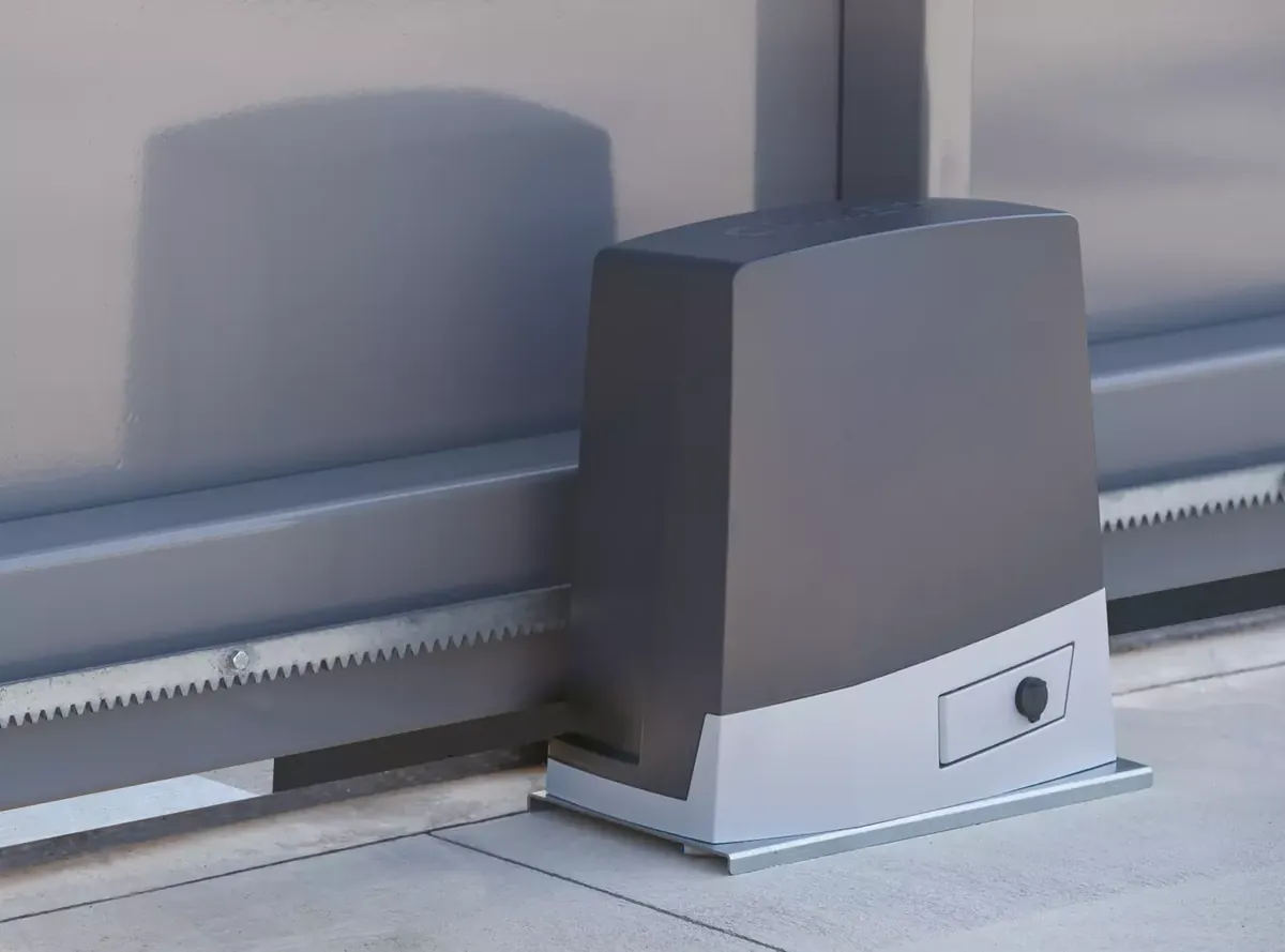 CAME BKV slide operator on its base beside the gate rack