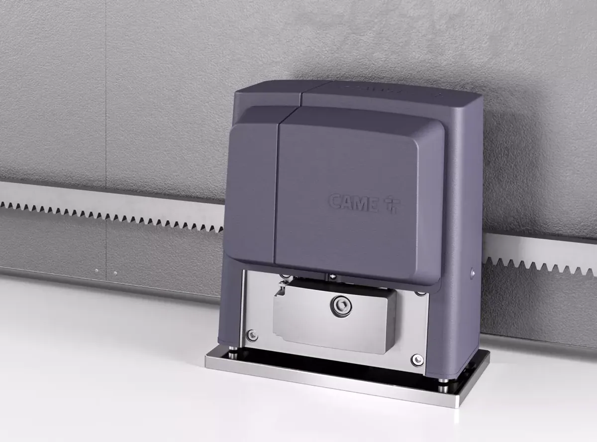 CAME BX slide operator on its base plate beside the gate rack