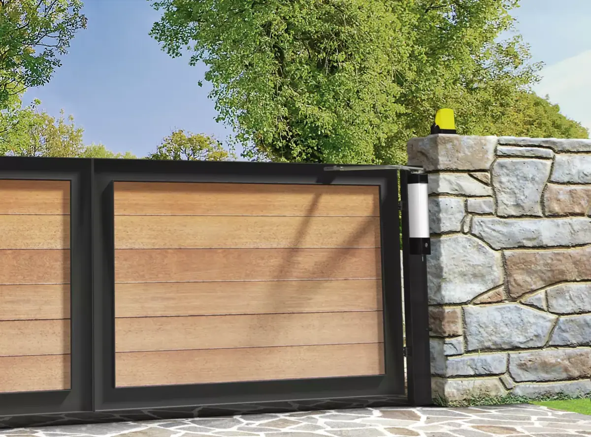 CAME STYLO on a wooden slat gate between stone pillars