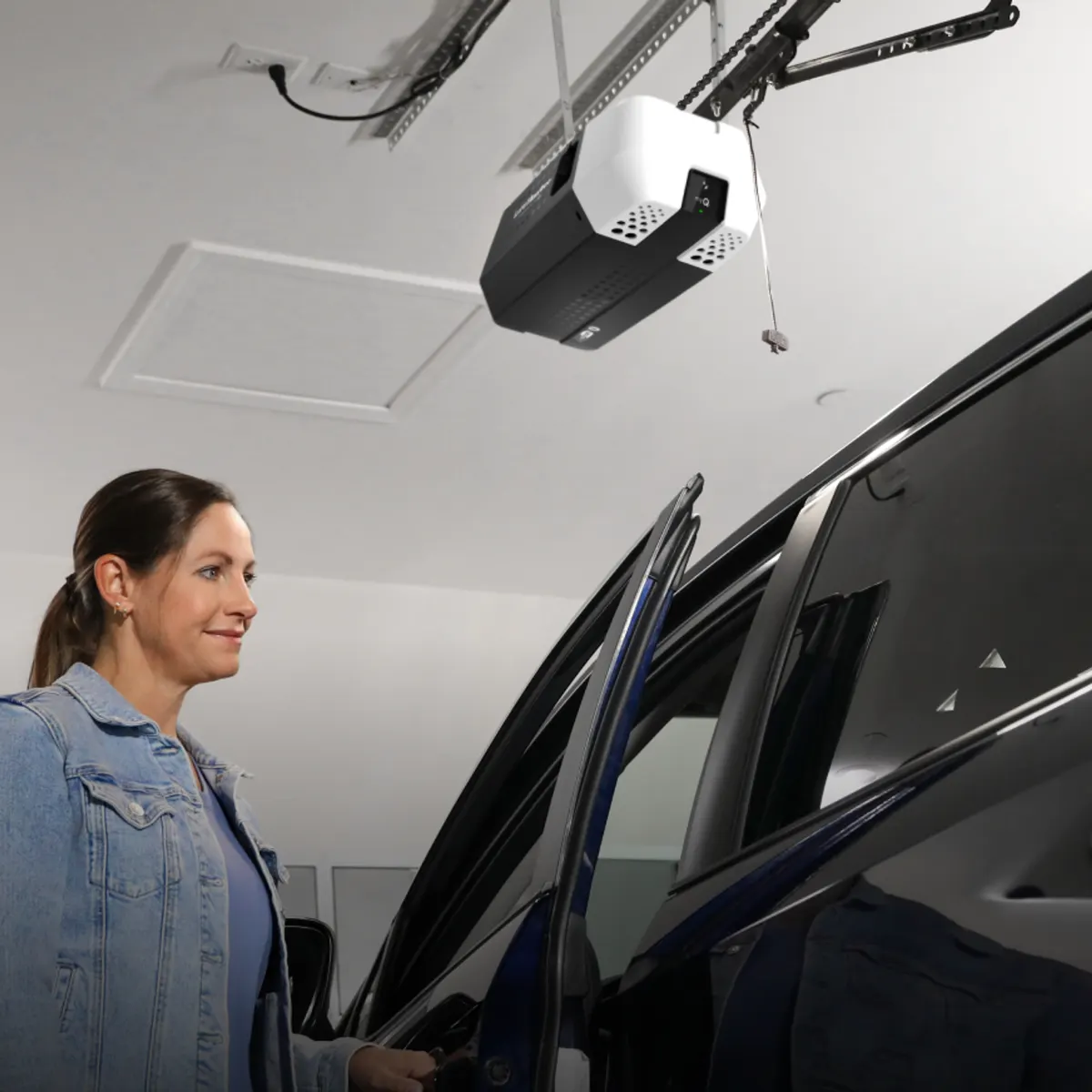 LiftMaster 2220L chain drive opener installed on a garage ceiling above a parked car