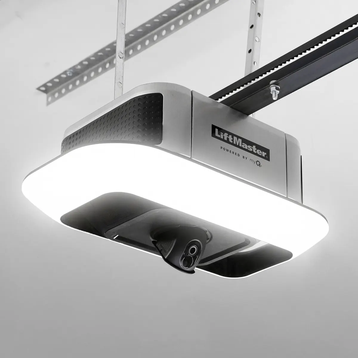 LiftMaster 6690L belt drive opener installed on a garage ceiling with its light ring glowing
