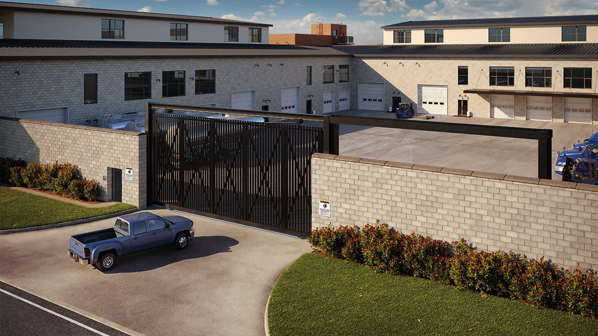 A black slide gate across a warehouse yard entrance, LiftMaster HDSL24UL render