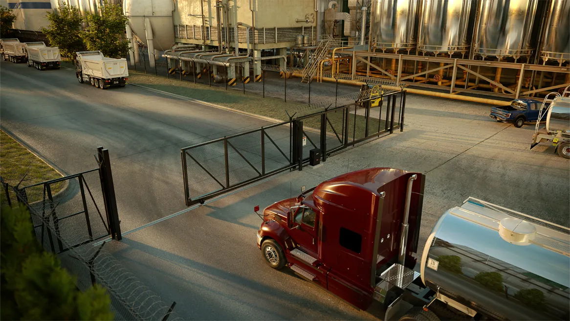 A tanker truck passing an industrial slide gate, LiftMaster INSL24UL render
